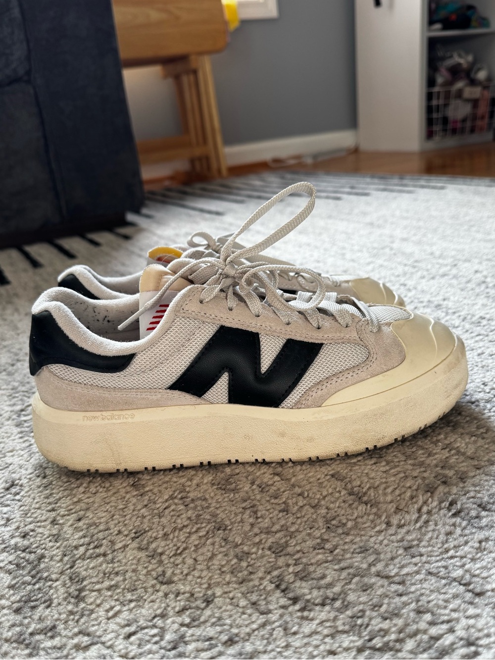 New Balance White and Black Low-Top Sneakers
